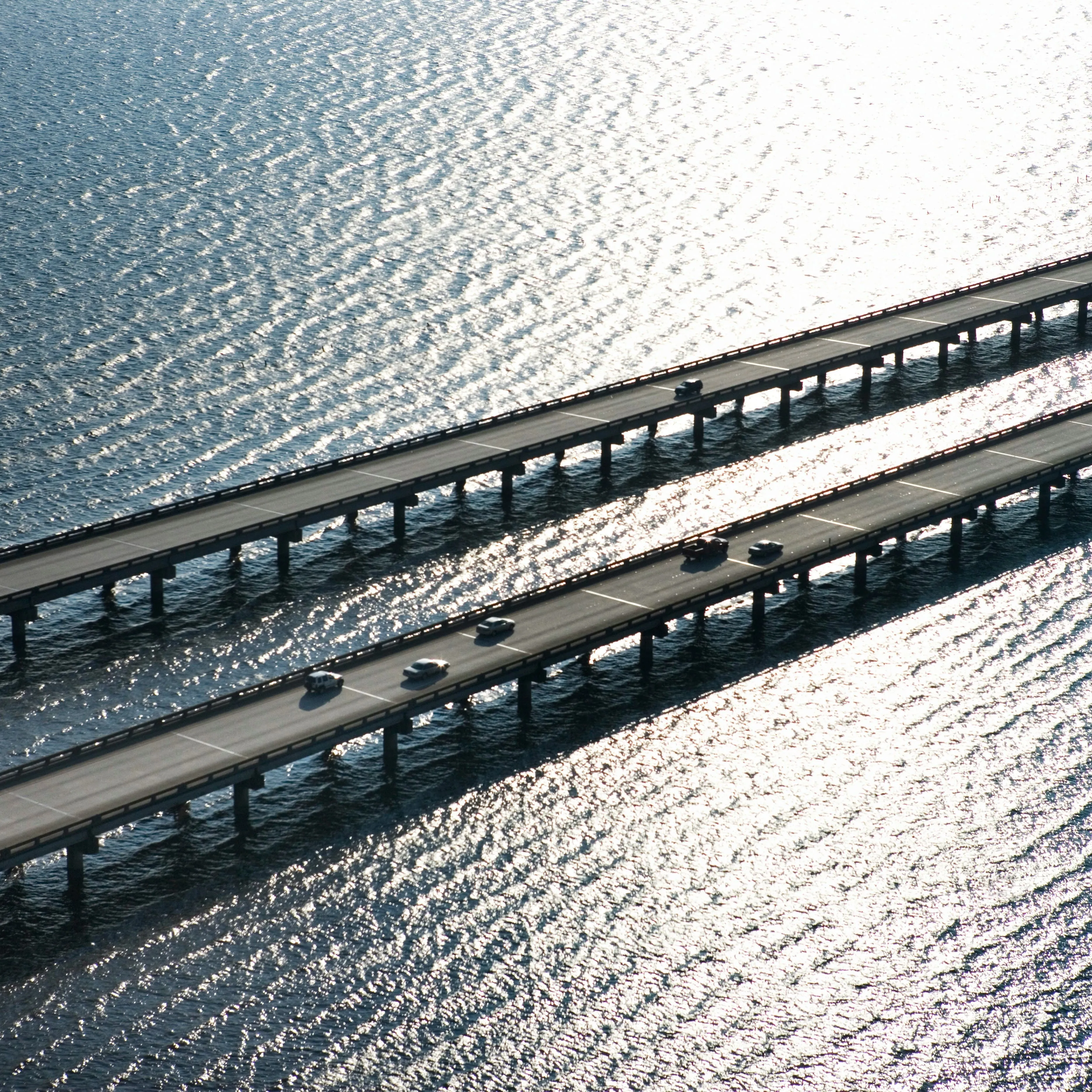 An image of two bridge highway going over a sea